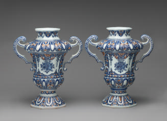 Pair of vases with handles and ornate floral decoration in blue and red