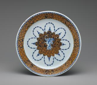 Circular plate with putti and a border of ornate yellow decoration