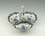 Blue and white porcelain tray with three containers and white fish, top view