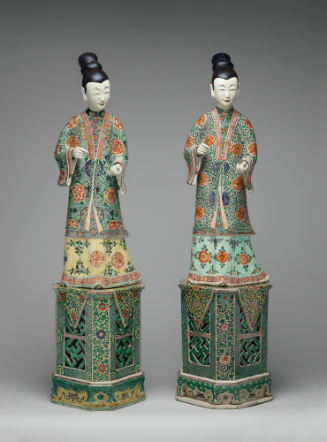 Two porcelain figures of ladies on stands with polychrome overglaze