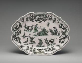 Large oval platter with figures, animals and flowers painted in green