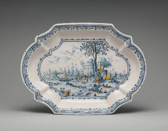 Large platter with a maritime scene painted in yellow, green and blue