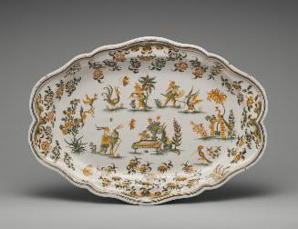 Large oval platter with figures and floral decoration in yellow and green
