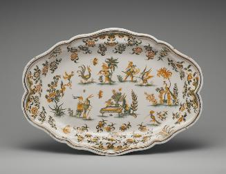 Large oval platter with figures and floral decoration in yellow and green