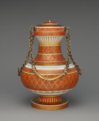 Red and gold porcelain vase with lid and gold chain