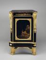 Side view of a cabinet in black and gold Japanese lacquer and ebonized wood with gilt bronze mo…