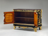 Interior view of a cabinet in black and gold Japanese lacquer and ebonized wood with gilt bronz…