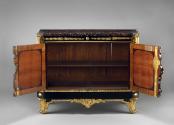 Interior view of a cabinet made from Japanese black and gold laquer and ebonized wood with gilt…