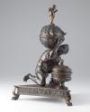 Bronze sculpture of crouching Atlas supporting globe with triangular base; side view