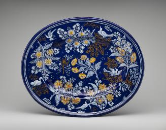 Oval platter with a deep blue background and floral decoration