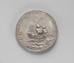 Silver medal of a war galleon, square sails full, moving away from the shore