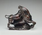 Alternate view of a bronze sculpture of a lion attacking a horse.  The lion is actively clawing…