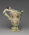 Alternate view of glazed Earthenware ewer with humanoid handle and lizard shaped spout, alterna…