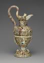 Alternate view of glazed earthenware ewer with grotesque designs and patterns