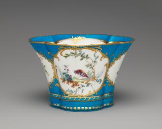 Porcelain four-lobed dish in blue, white, and gold with birds