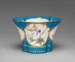 Alternate view of porcelain four-lobed dish in blue, white, and gold with birds