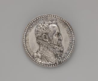 Silver portrait medal of the Duke of Alba.  He is shown in profile on his right side.  He wears…