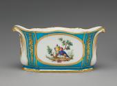 Alternate view of porcelain oval dish in blue, white, and gold with birds