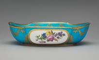 Basin in blue, white, and gold with images of flowers