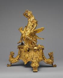 Gilt bronze andiron with female figure seated on the back of an eagle, with supports in the for…
