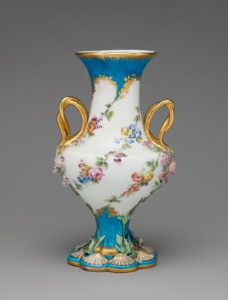 Porcelain vase in blue and white with gold handles