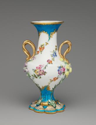 Porcelain vase in blue and white with gold handles