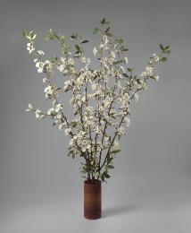 A porcelain sculpture of white cherry blossoms in a terracotta pot