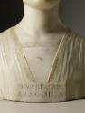 Close up view of a marble bust of the Beatrice of Aragon.  Her hair is neatly wrapped behind he…