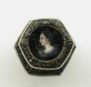 View of saltcellar from above showing the bowl decorated with a portrait of an aristocratic lad…