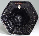 View of the underside of the base with gilt fleur de lys against a blue enameled background