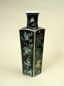 Square porcelain vase with black ground and floral and vegetal designs