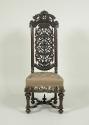Alternate view of walnut chair with openwork back and embroidered seat showing flowers, fruit, …