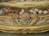 Detail of the mask in the tapestry on a Canapé: Part of a Set of Two Canapés, Eight Armchairs a…