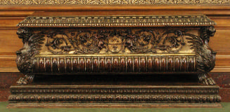 Oblong walnut chest with harpies, winged lions, and vegetal decoration, gilded
