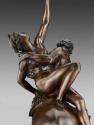 Close-up of a bronze sculpture of a woman struggling against a centaur