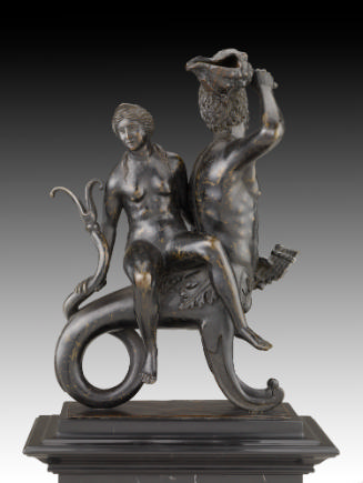 A bronze sculpture of Triton and Nereid.  Triton is depicted as half man, half fish.  The nerei…