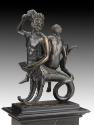 A bronze sculpture of Triton and Nereid.  Triton is depicted as half man, half fish.  The nerei…