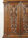 Detail of carved decoration from cabinet, showing vegetal motifs