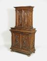 Alternate view of walnut and pine cabinet with relief carving