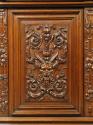 Detail of carved decoration from cabinet, showing satyr head