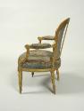 Side view of an Armchair with Tapestry Covers Showing Flowers on Blue Grounds