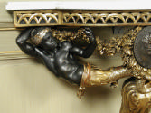 Detail of nubian figure supporting tabletop on a Small Console Table (One of a Pair)