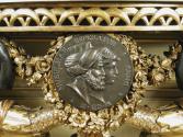 Detail of medal with two profiles, including a man in a turban, on a Small Console Table with S…