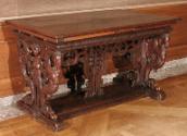 Walnut table with carved openwork supports