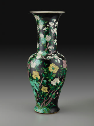 Black ground porcelain vase with yellow, white, and pink  flowers