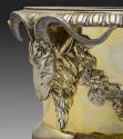 Detail of ram's head on gold and silver wine cooler