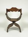 Walnut folding armchair with central shield