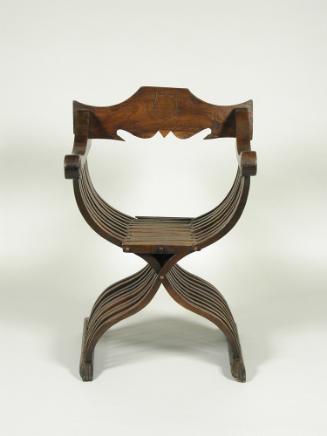 Walnut folding armchair with central shield