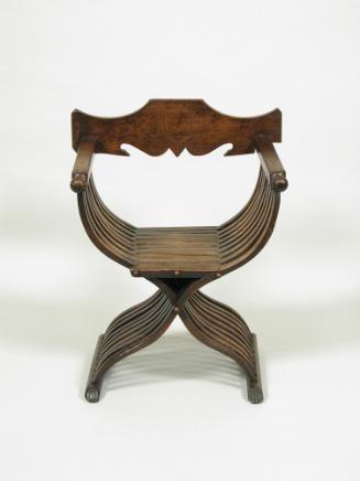 Walnut folding armchair with central shield