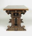 Draw-Top Center Table with Columnar Supports and Masks, side view